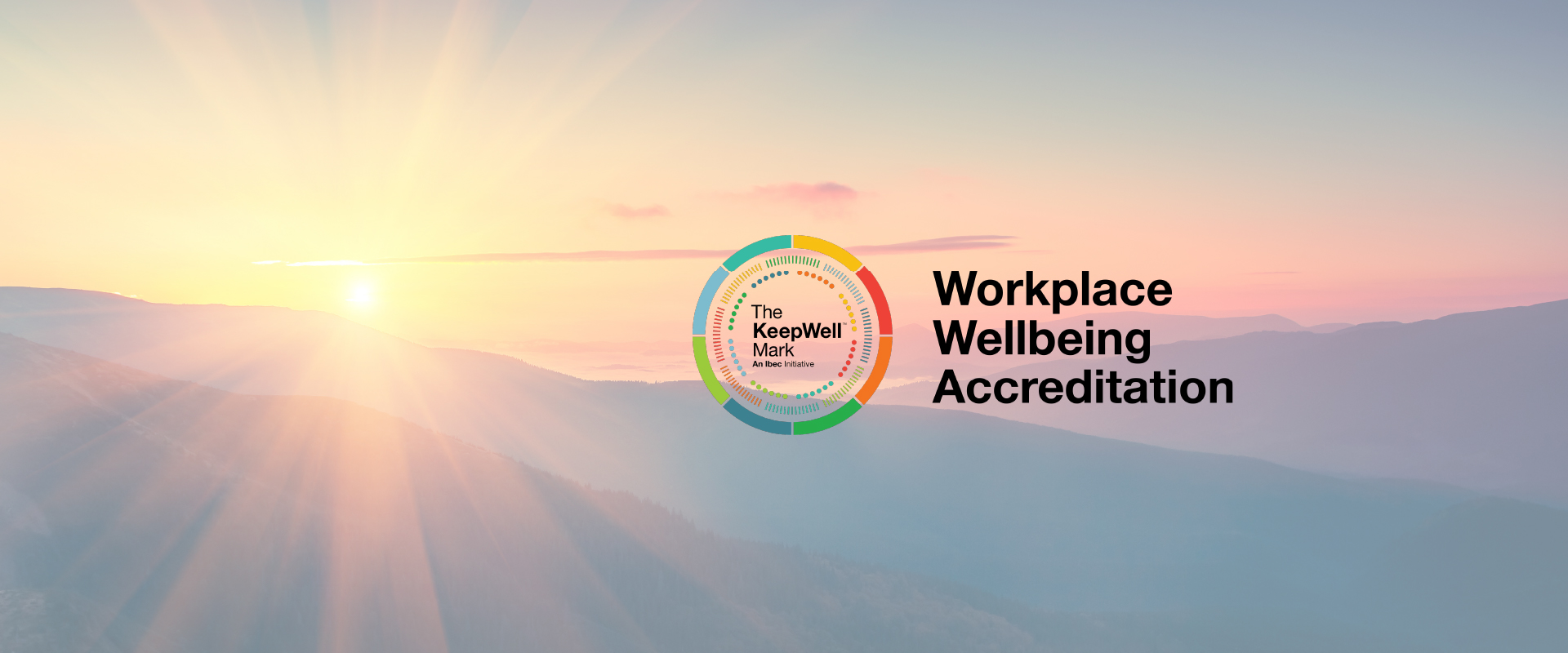 Image of a sunset and corporate logo